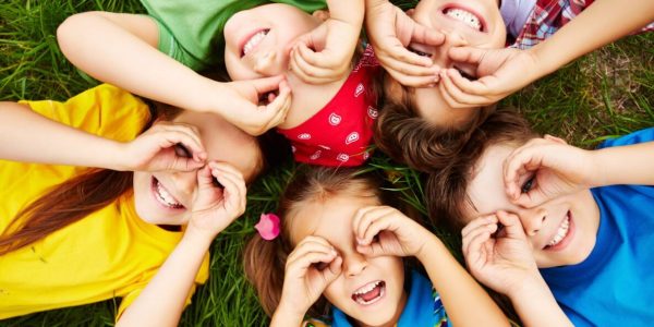 children-playing-grass-scaled